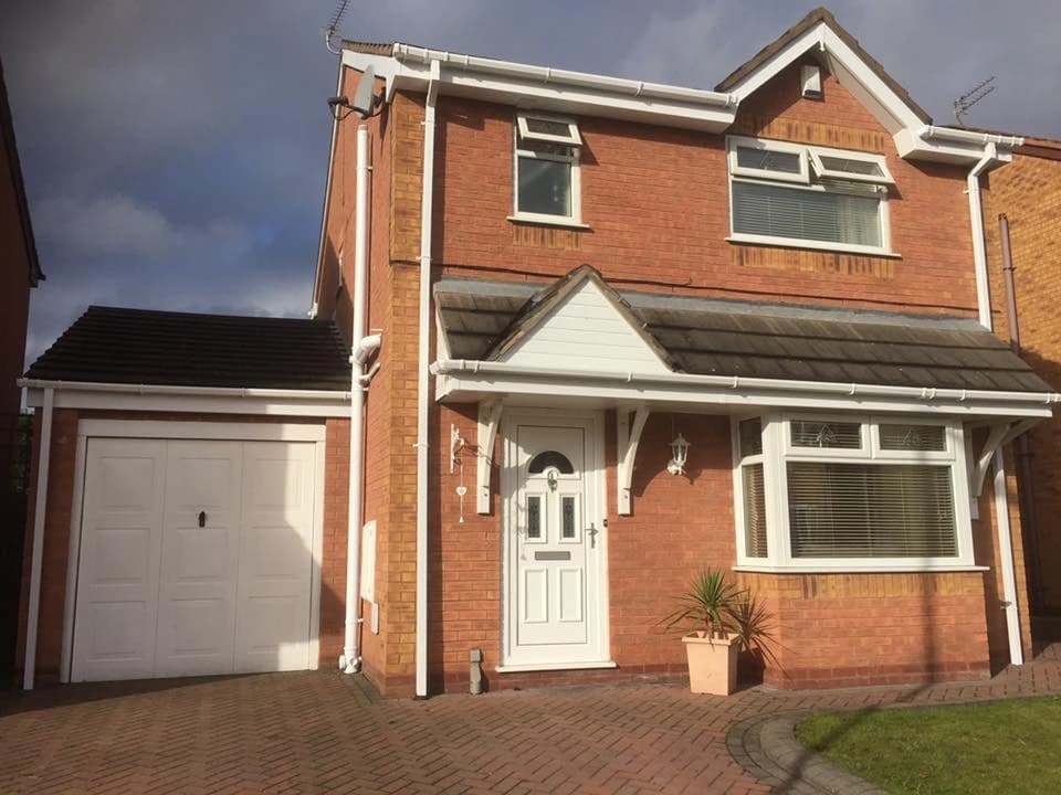 Completed roofline and flat roof repair on a Merseyside detached home by Sefton Roofing