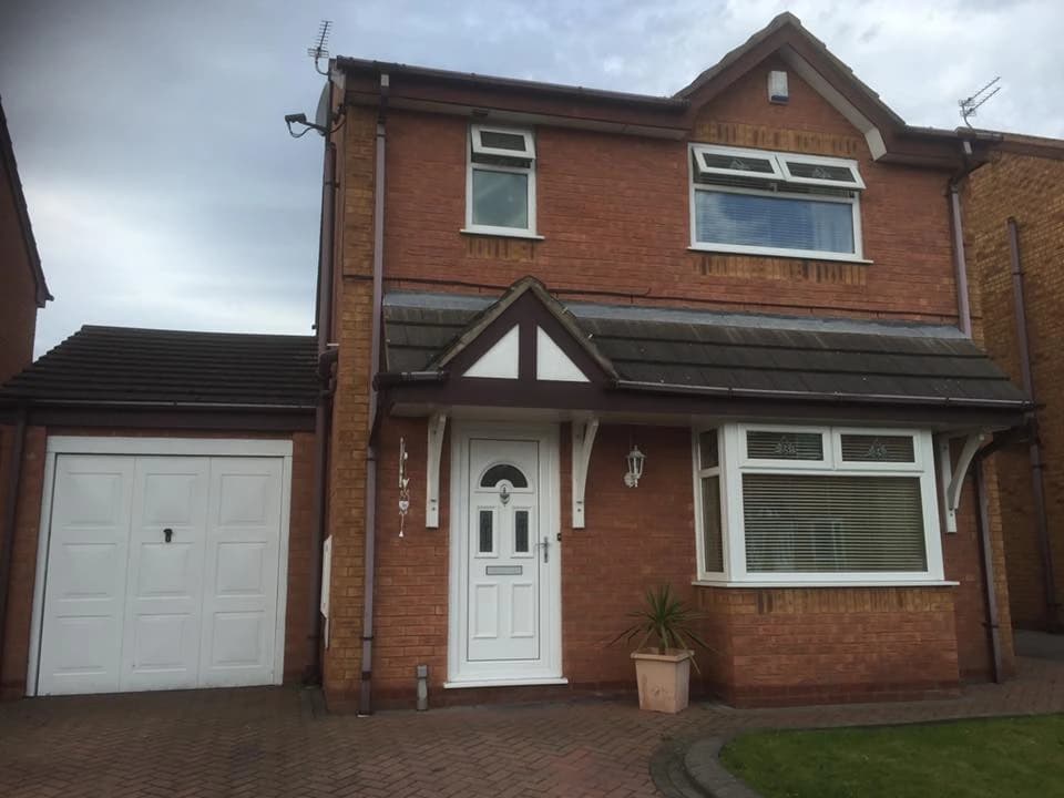 Completed roofing work on a red-brick Liverpool property with garage, by Sefton Roofing